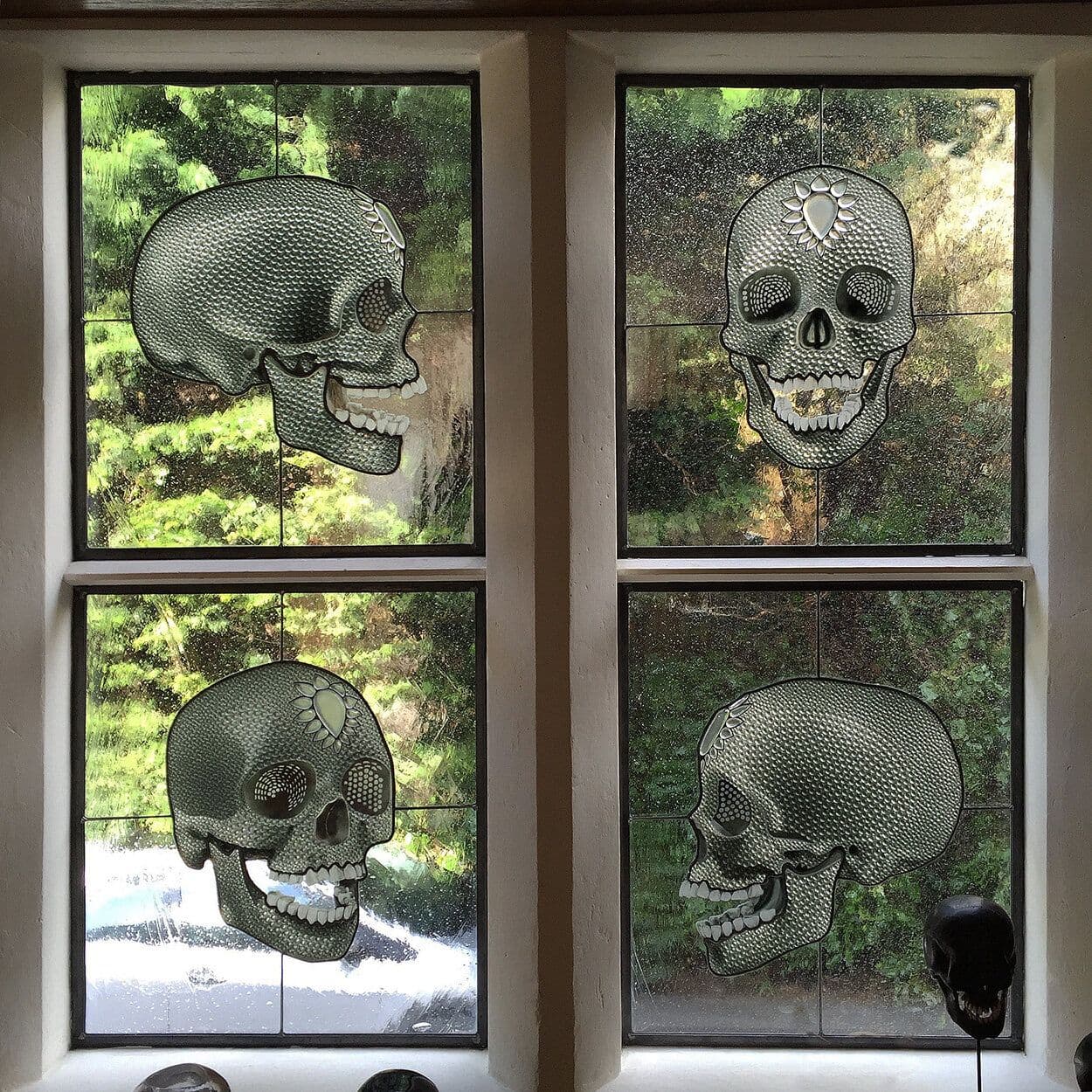 Four completed skull windows installed together