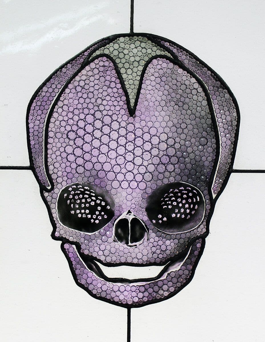 Completed purple skull in three-quarter view against blue