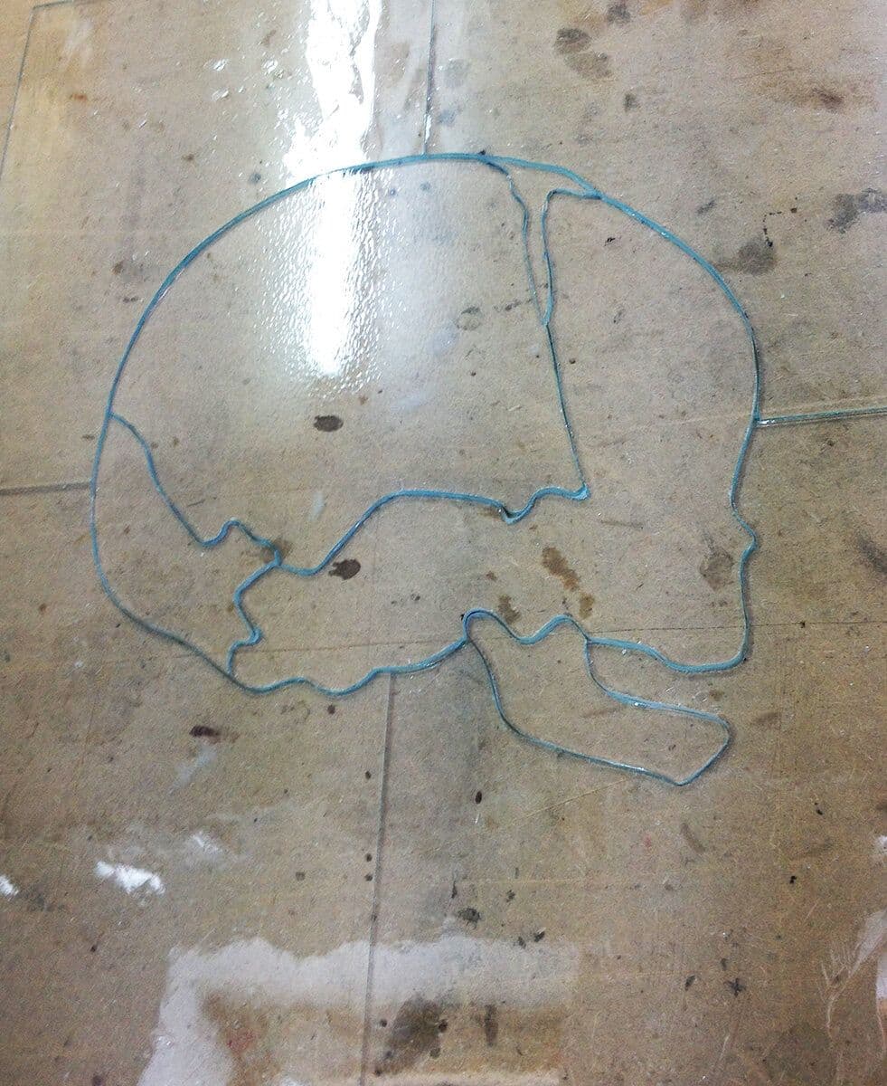 Full-size skull outline marked out as a guide for shaping the glass pieces