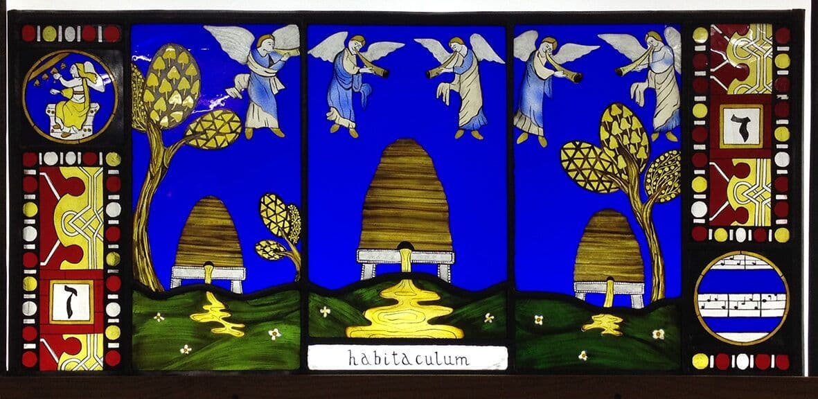Close view of the blue, red and gold imagery within the seven-heavens window