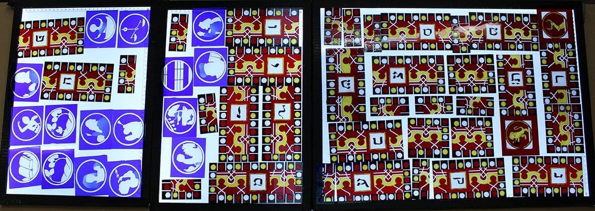 Design panels and colour studies laid out together in the studio