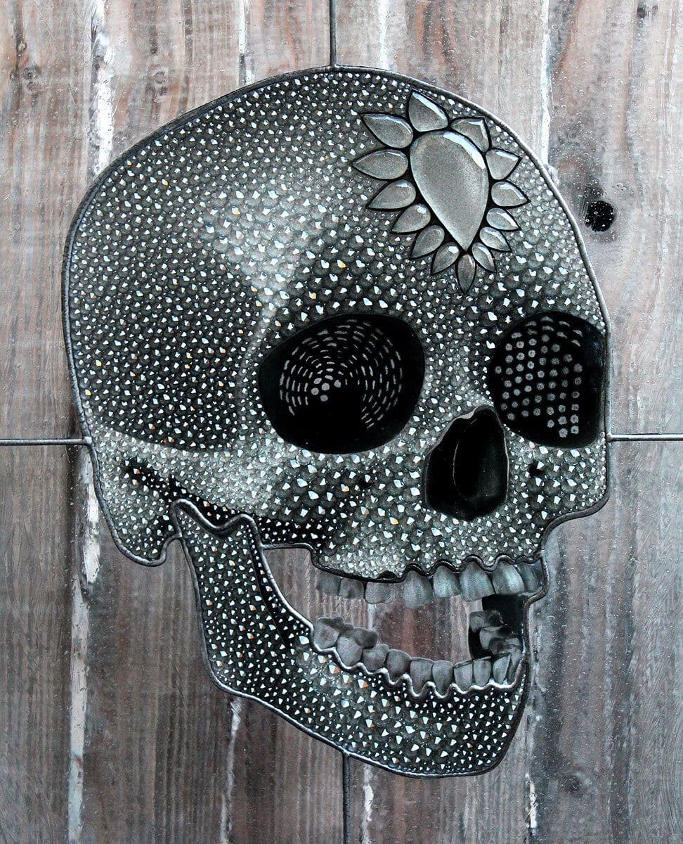 Completed dark skull window densely covered with sparkling crystals