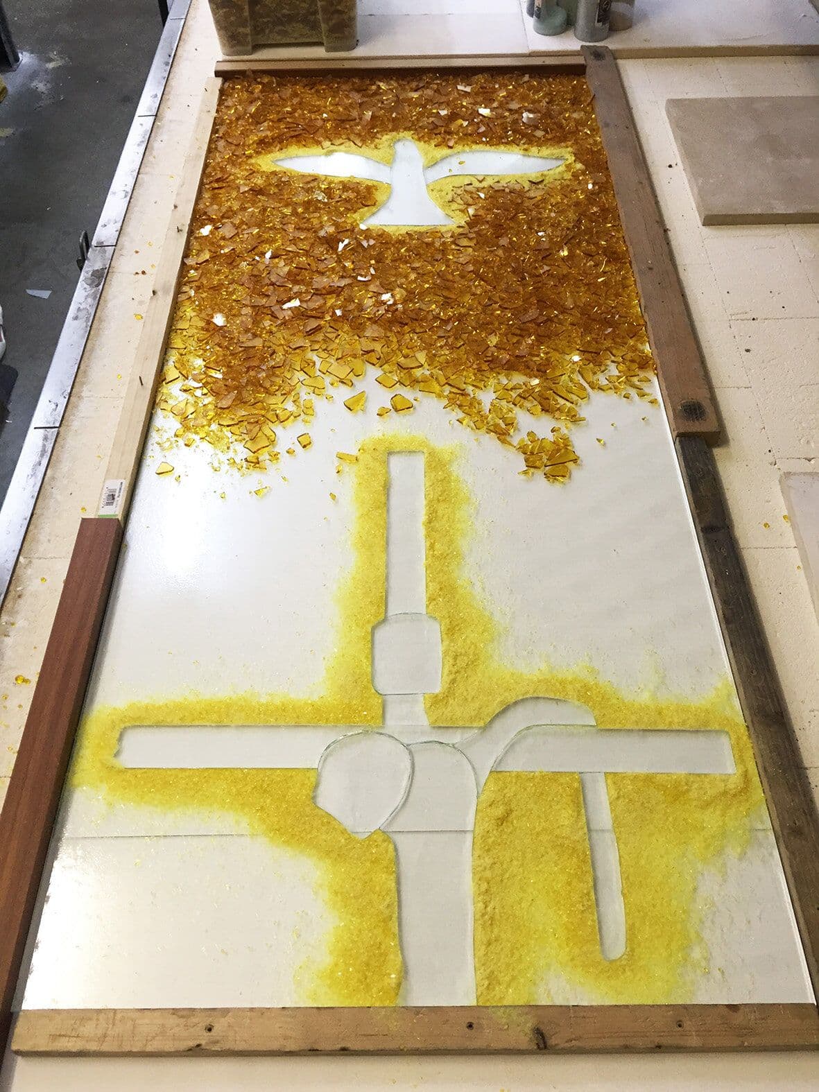 Yellow fused-glass base with reserved white crucifixion form