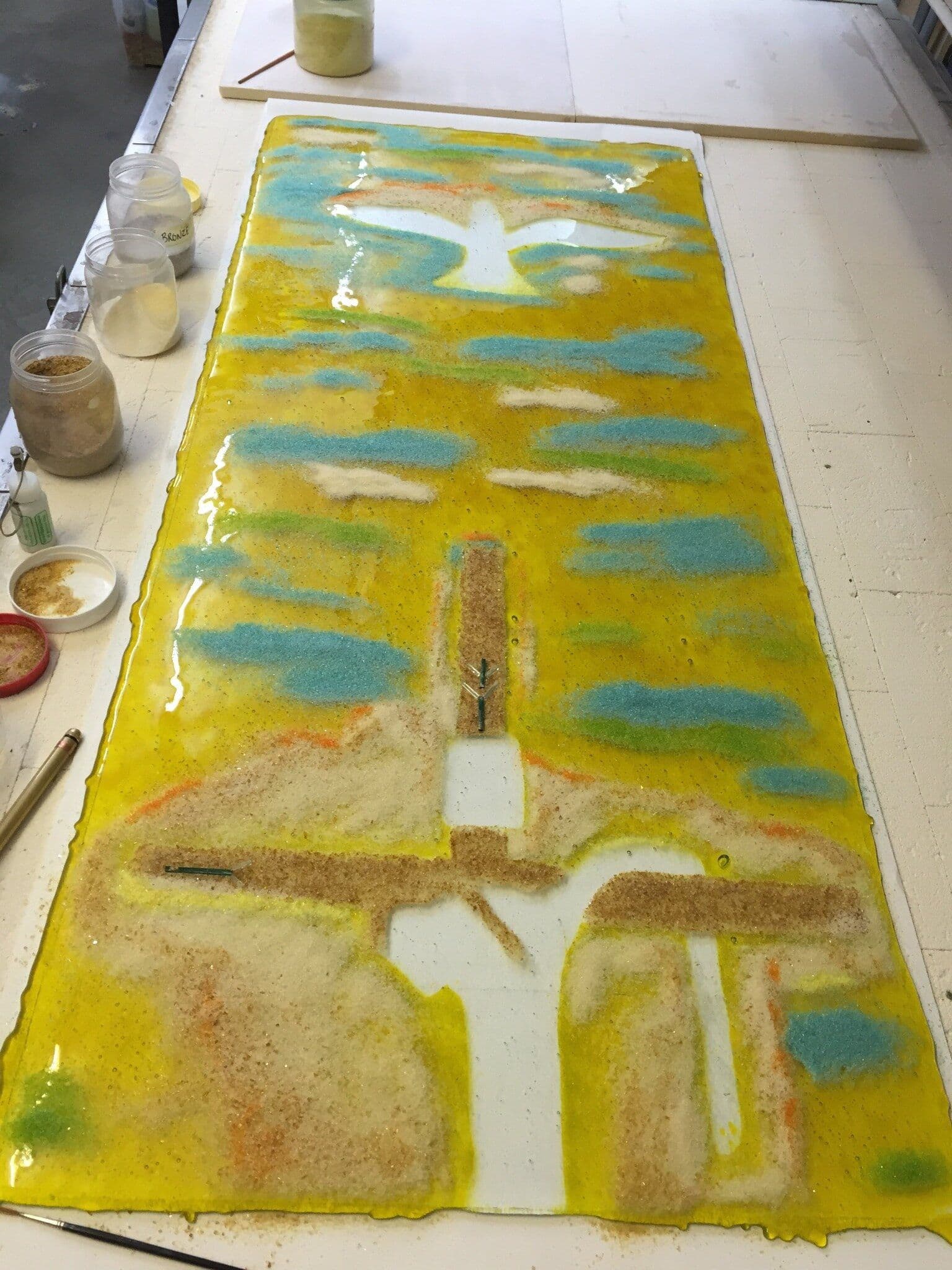 The full chapel window panel with yellow glass and frit arranged over the clear base glass